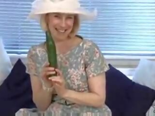 Grown housewife fucks a cucumber